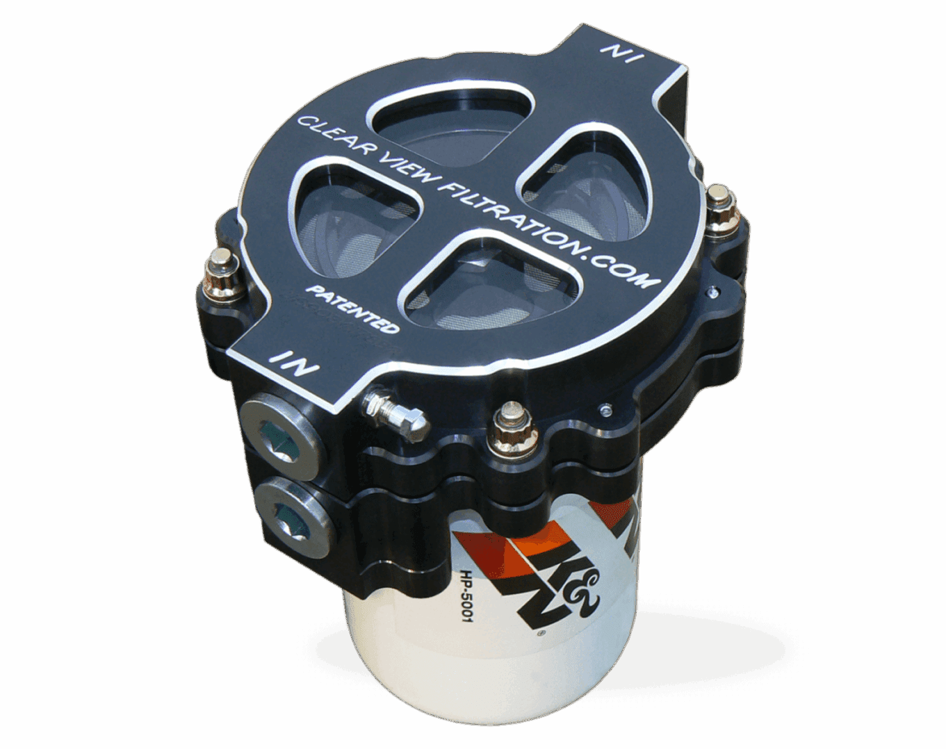 An automotive oil filter with a transparent top, featuring bolts and branding.