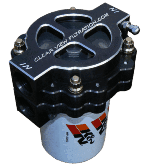 Close-up of a black and white fuel filter with metallic bolts.