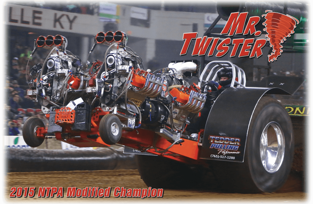 A powerful drag racing tractor with twin engines in action.